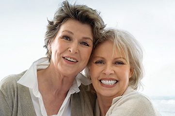 Photo of two smiling women.
